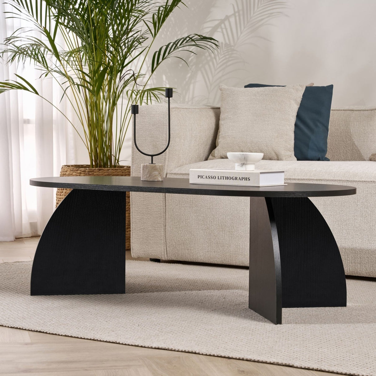 Melina Couchtisch oval aus Holz schwarz 120 cm Melaminbeschichteter Holzverbundstoff
