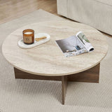 Runder Couchtisch mit Travertinplatte und dunklem Holzsockel in Kreuzform.