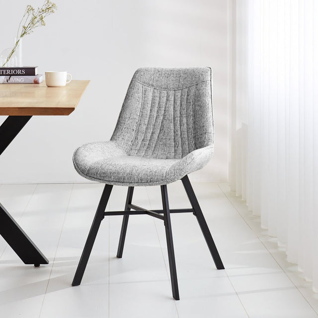 Esszimmerstuhl Jada Dimehouse Grau LxBxH 79x57x53 Stoff Stimmungsvolles Foto diagonal von vorne