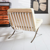 Sessel Expo Dimehouse Creme LxBxH 80x78x78 Rindsleder Stimmungsvolles Foto diagonale Rückansicht