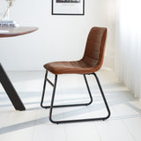 Esszimmerstuhl Mark Dimehouse Cognac LxBxH 74x56x54 Kunstleder Stimmungsvolles Foto Seitenansicht