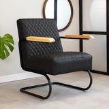 Sessel Lars Dimehouse Schwarz LxBxH 68x64x39 Kunstleder Stimmungsvolles Foto diagonal von vorne